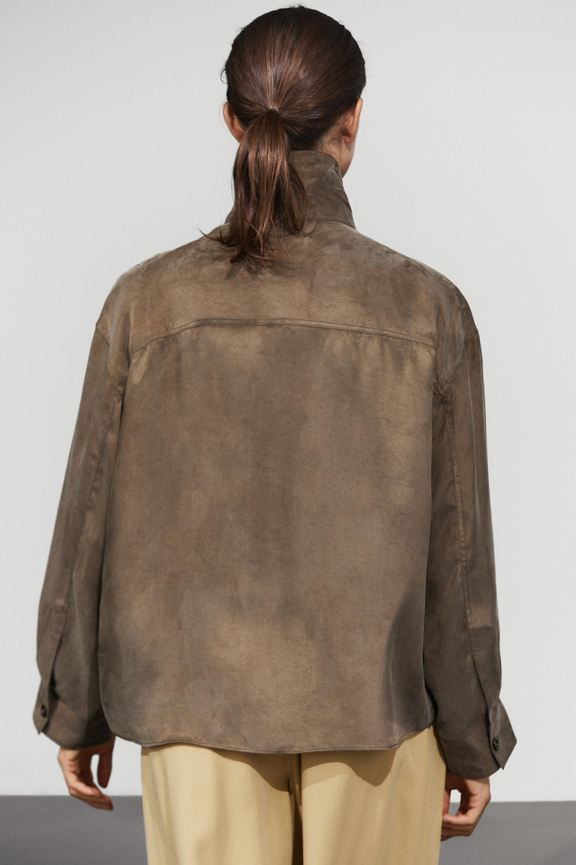 Flowing shirt with stand collar and bib detail